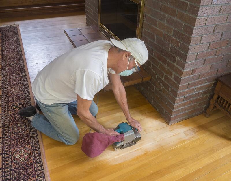 man polishing a floor